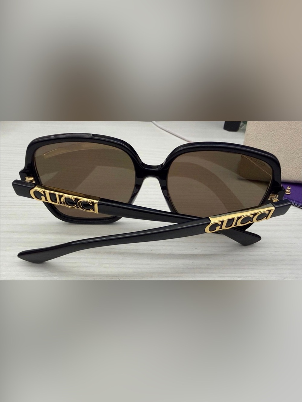 Gucci Black Sunglasses with large Gold Gucci Logo and Burgundy Pouch